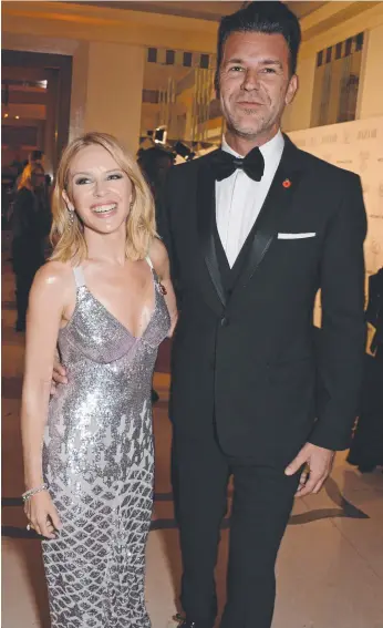  ?? Picture: GETTY IMAGES ?? Kylie Minogue and Paul Solomons attend a function in London.