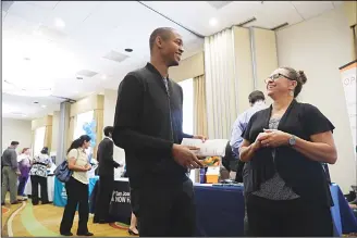  ?? (AP) ?? In this photo, Kathy Tringali (right), a recruiter for Big 5 Sporting Goods, talks to job seeker Jarrell Palmer during a job fair, in san Jose, California, on Aug 30, the Commerce Department issues the second of three estimates of
how the US economy...