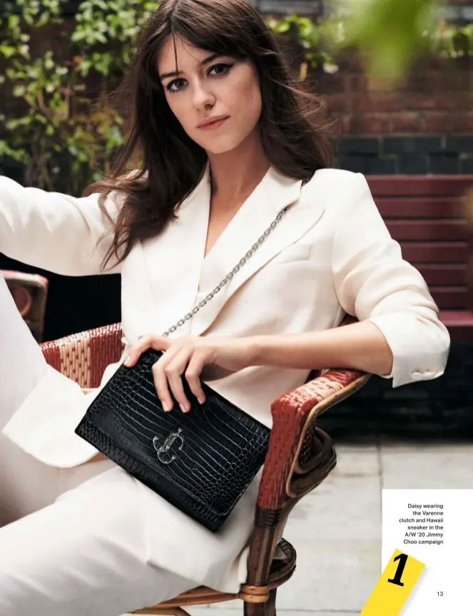  ??  ?? Daisy wearing the Varenne clutch and Hawaii sneaker in the A/W ’20 Jimmy Choo campaign