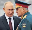  ?? ?? President Vladimir Putin speaks with his defence minister Gen Sergei Shoigu