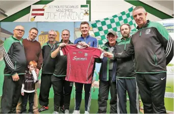  ??  ?? Galway hurler presents a Galway jersey to St Molaise Gaels club. Pics: Charlie Brady.
