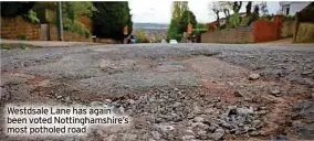  ?? ?? Westdsale Lane has again been voted Nottingham­shire’s most potholed road