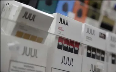  ?? SETH WENIG — THE ASSOCIATED PRESS ARCHIVES ?? Philip Morris and Altria have ended merger talks, and JUUL’s CEO is stepping down from the top post as criticism over vaping continues to intensify. E-cigarettes have been largely unregulate­d since arriving in the U.S. in 2007.