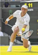  ?? THE ASSOCIATED PRESS ?? Gilles Muller returns to Rafael Nadal on Monday during their men’s singles match on day seven at Wimbledon in London. Muller won 6-3, 6-4, 3-6, 4-6, 15-13.