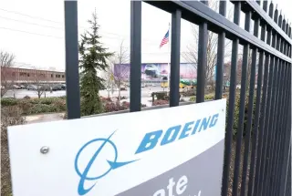  ?? AFP PHOTO ?? TURBULENCE
Boeing’s Renton factory in Washington is pictured as Boeing’s 737 factory teams hold the first day of a “Quality Stand Down” for the 737 program, on Jan. 25, 2024. While its 739 MAX 9 planes take flight once more, the aerospace company is bracing for a possible impact on its finances in the future.