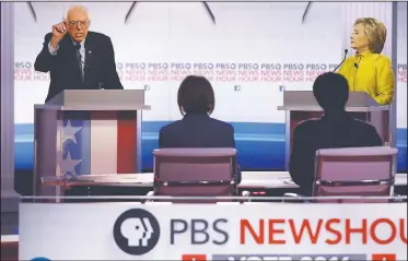  ?? AP/MORRY GASH ?? Sen. Bernie Sanders, D-Vt., argues a point Thursday as Hillary Clinton listens during a Democratic presidenti­al primary debate at the University of Wisconsin-Milwaukee in Milwaukee.