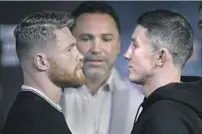  ?? John Gurzinski AFP/Getty Images ?? CANELO ALVAREZ, left, and Gennady Golovkin face off, quietly, at news conference. They are ill at ease with English.