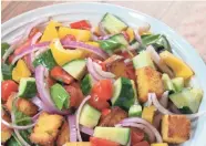  ?? ALYSHA WITWICKI ?? Toasted cornbread squares are tossed with summer produce for a colorful, healthy panzanella salad.