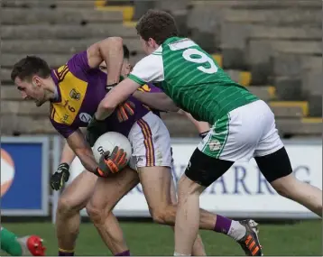  ??  ?? Captain and centre-back Brian Malone breaking away from London’s Charles Doherty on his record-breaking 165th appearance in the county Senior jersey.