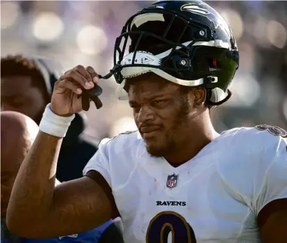  ?? PHELAN M. EBENHACK/ASSOCIATED PRESS ?? After an offseason of discontent, former MVP Lamar Jackson agreed to stay in Baltimore.