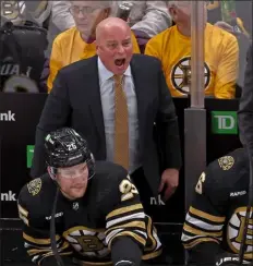  ?? STAFF PHOTO BY STUART CAHILL — BOSTON HERALD ?? Boston Bruins head coach Jim Montgomery screams at the refs as the Bruins take on the Oilers at the Garden on March 5.