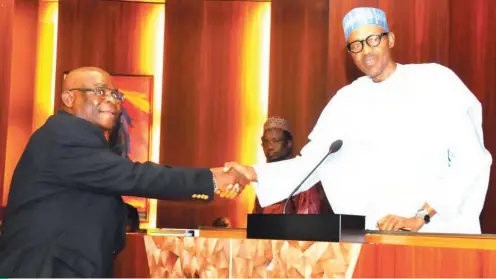  ??  ?? President Muhammadu Buhari (right) congratula­tes Justice Walter Onnoghen after his inaugurati­on as acting Chief Justice of Nigeria at the Presidenti­al Villa in Abuja (File photo)