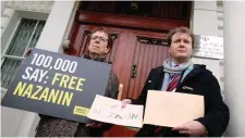  ?? Photo: PA ?? Richard Ratcliffe (right), the husband of jailed mother Nazanin Zaghari-Ratcliffe, and Kate Allen, from Amnesty Internatio­nal, hand in a letter to the Iranian Embassy in London.