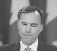  ?? SEAN KILPATRICK / THE CANADIAN PRESS ?? Minister of Finance Bill Morneau’s proposed boundaries on the use of private corporatio­ns for “tax planning” is developing into a political hot potato, columnist Andrew Coyne writes.