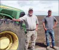  ??  ?? Chris Schaefers, left, and his brother, James Schaefers, stand in front of a field that was flooded in June. The land, which was to be planted in soybeans, backs up to Cadron Creek, which flooded when the Arkansas River flooded.