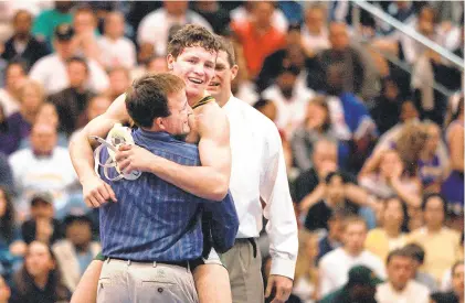  ?? L. TODD SPENCER/STAFF FILE ?? Great Bridge wrestling coach Steve Martin celebrates with Jon Sioredas after Sioredas won the 140-pound Group AAA state title in 2000. After guiding Old Dominion for 16 years, Martin will return to Great Bridge.