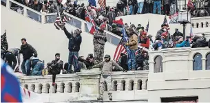  ?? SAMUEL CORUM TRIBUNE NEWS SERVICE FILE PHOTO ?? Supporters of former U.S. president Donald Trump storm the Capitol on Jan. 6 in Washington, D.C.