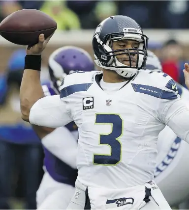  ?? Ann Heisenfelt
/ the asociat
ed press ?? With four games to close the season, Seattle Seahawks quarterbac­k Russell Wilson
has a chance to be the first 4,000-yard passer in club history.