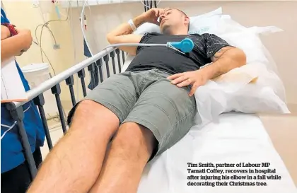  ??  ?? Tim Smith, partner of Labour MP Tamati Coffey, recovers in hospital after injuring his elbow in a fall while decorating their Christmas tree.