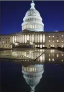  ?? J. Scott Applewhite/Associated Press ?? The Capitol is seen at dusk on Friday as the U.S. Senate was in a standoff on the $1.9 trillion COVID-19 relief bill.