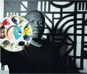 ?? Picture: Brandon Barnard ?? Baba Tjeko embraces the importance of branding along with his dedication to art.