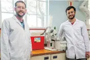  ?? Picture: Stefan Els ?? INNOVATION: PhD chemistry students Anton Hamann, left, and Jonathan Hay with the Closed Cold Water RecyclingS­ystem they developed for their laboratory at Stellenbos­ch University.