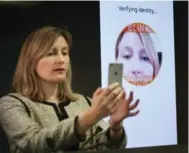  ?? RICHARD LAUTENS/TORONTO STAR ?? MasterCard executive Catherine Murchie demonstrat­es “selfie” pay technology that allows users to take a picture of themselves to pay for purchases.