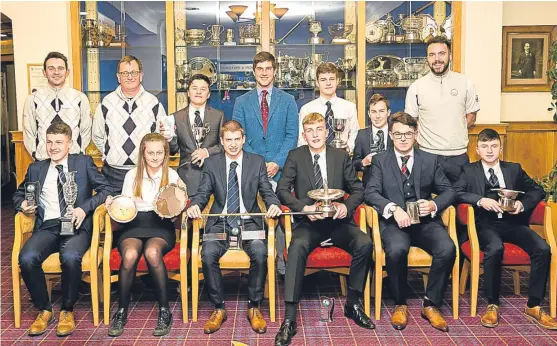  ?? Picture: Angus Forbes. ?? European Tour star Bradley Neil, back centre, with Blairgowri­e Golf Club junior section 2017 trophy winners and club profession­als Neil Cameron, Charles Dernie and Sam McLaren.