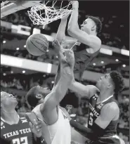  ?? AP/CHARLES KRUPA ?? Texas Tech’s Zhaire Smith dunks over Villanova’s Eric Paschall for his only two points in the Red Raiders’ 71-59 loss to Villanova on Sunday in the East Regional Final in Boston.