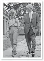  ?? AP PHOTO ?? A 1961 publicity shot shows French actor Maurice Chevalier walking hand in hand with Hayley Mills as they met for the first time before filming the Disney movie “The Castaways.”