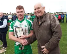  ??  ?? Wicklow People sports reporter LiamO’Loughlin presents Christophe­r Grimes with the Wicklow People sponsored Man of the Match award.