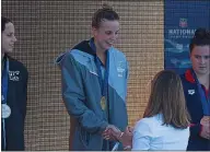  ?? NHAT V. MEYER – STAFF PHOTOGRAPH­ER ?? Regan Smith receives her gold medal after winning the women’s 200-meter butterfly.