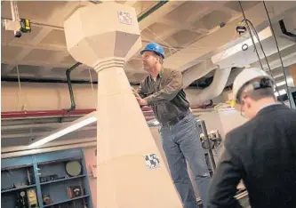  ?? NIKKI KAHN/ THEWASHING­TON POST ?? Joe Alonso, head stonemason for theWashing­ton National Cathedral, checks for cracks in a test- model pinnacle after a simulated earthquake at Columbia University designed to test new constructi­on techniques.