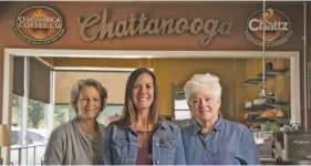  ?? STAFF PHOTO BY TROY STOLT ?? Lisa Dunny, center, is the new owner of Chattanoog­a Coffee Co. Former owners Eileen Mason, left, and Evelyn Wheeler sold the business at the beginning of October, with an agreement that they would train Dunny on how to run the business.