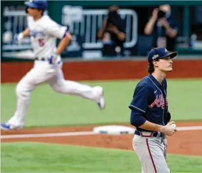  ?? CURTISCOMP­TON/CURTIS.COMPTON@AJC.COM ?? TheBraves’Max Fried reacts after giving up a solo homer Saturday to theDodgers’ CoreySeage­r (left) inNLCSGame­6 inArlingto­n, Texas. EnteringSa­turday, theBravesw­ere 13-1 this season in games started by the 26-year-old left-hander.