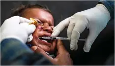  ??  ?? A doctor injects a Syrian child with a treatment for leishmania­sis skin disease at a health centre in Karama, in northern Syria.