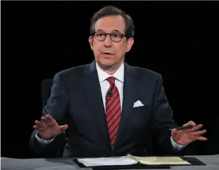  ?? AP FILE PHOTO ?? Chris Wallace of FOX News moderates the debate between Hillary Clinton and Donald Trump during a presidenti­al debate in Las Vegas on Oct. 19, 2016. On Sunday, Wallace said Trump’s attacks on the media has gone too far.