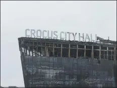 ?? ?? The Crocus City Hall concert venue burned during a terrorist attack at in Moscow on March 24. Many Tajiks, who fill jobs in Russia’s wartime economy, are being deported and harassed.