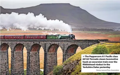  ?? Danny Lawson/Press Associatio­n ?? The Peppercorn A1 Pacific class 60163 Tornado steam locomotive hauls an excursion train over the Ribblehead viaduct in the Yorkshire Dales yesterday