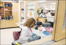  ?? NEWS PHOTO EMMA BENNETT ?? Karen Rioux works at Medicine Hat Diagnostic Laboratory on Monday.An announceme­nt on Monday about laboratory services in Medicine Hat turned out to be nothing new and has angered many local lab staff.