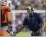  ?? MATTHEW HINTON — THE ASSOCIATED PRESS FILE ?? In this file photo, Syracuse coach Dino Babers celebrates a touchdown with his team against LSU in the second half of an NCAA college football game.