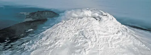  ?? Pete Bucktrout / British Antarctic Survey via the New York Times ?? Mount Michael in Antarctica was added as the eighth volcano in a list of those with a persistent lava lake.