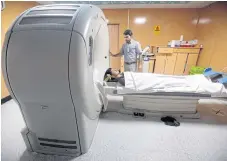  ??  ?? SIGNS OF HEALTH: A patient receives a CT scan at an Amiri private hospital in Kabul late last month.