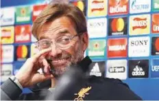  ?? Reuters ?? Juergen Klopp reacts as the interprete­r speaks during a press conference at Anfield yesterday.