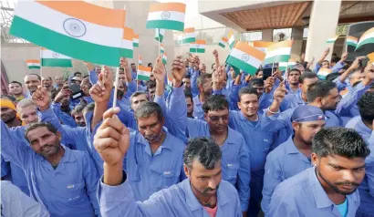  ?? KT file ?? Indian workers during the Independen­ce Day celebratio­ns at the Indian Embassy in Abu Dhabi. New guidelines of the Indian Community Welfare Fund offers more financial and legal assistance for the expat workers in the UAE. —