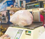  ??  ?? Grocers have been stocking up on whole turkeys at near the same pace as years past, but it's not known whether
customers will buy them, says one poultry executive.