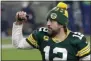  ?? MIKE ROEMER - THE ASSOCIATED PRESS ?? Green Bay Packers quarterbac­k Aaron Rodgers pumps his fist after an NFL divisional playoff football game against the Los Angeles Rams Saturday, Jan. 16, 2021, in Green Bay, Wis. .