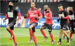  ??  ?? GUINGAMO: Guingamp’s players warm up prior to the French L1 football match Guingamp against Nice yesterday at the Roudourou stadium in Guingamp, western of France. — AFP