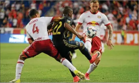  ?? MICHEAL REEVES — FOR DIGITAL FIRST MEDIA ?? Fafa Picault is sandwiched by Red Bulls Tyler Adams (No. 4) and Daniel Royer during Wednesday night’s Open Cup game won by New York in a penalty kick shootout.