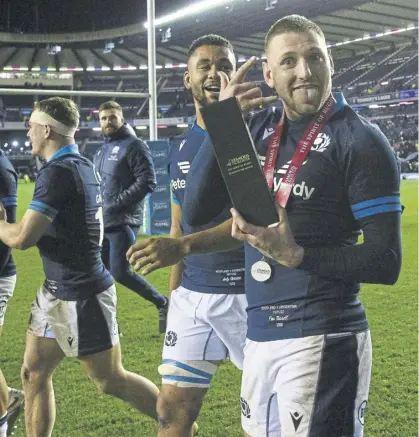  ?? ?? The return of Finn Russell – and with a smile on his face – has lifted the mood among Scotland supporters